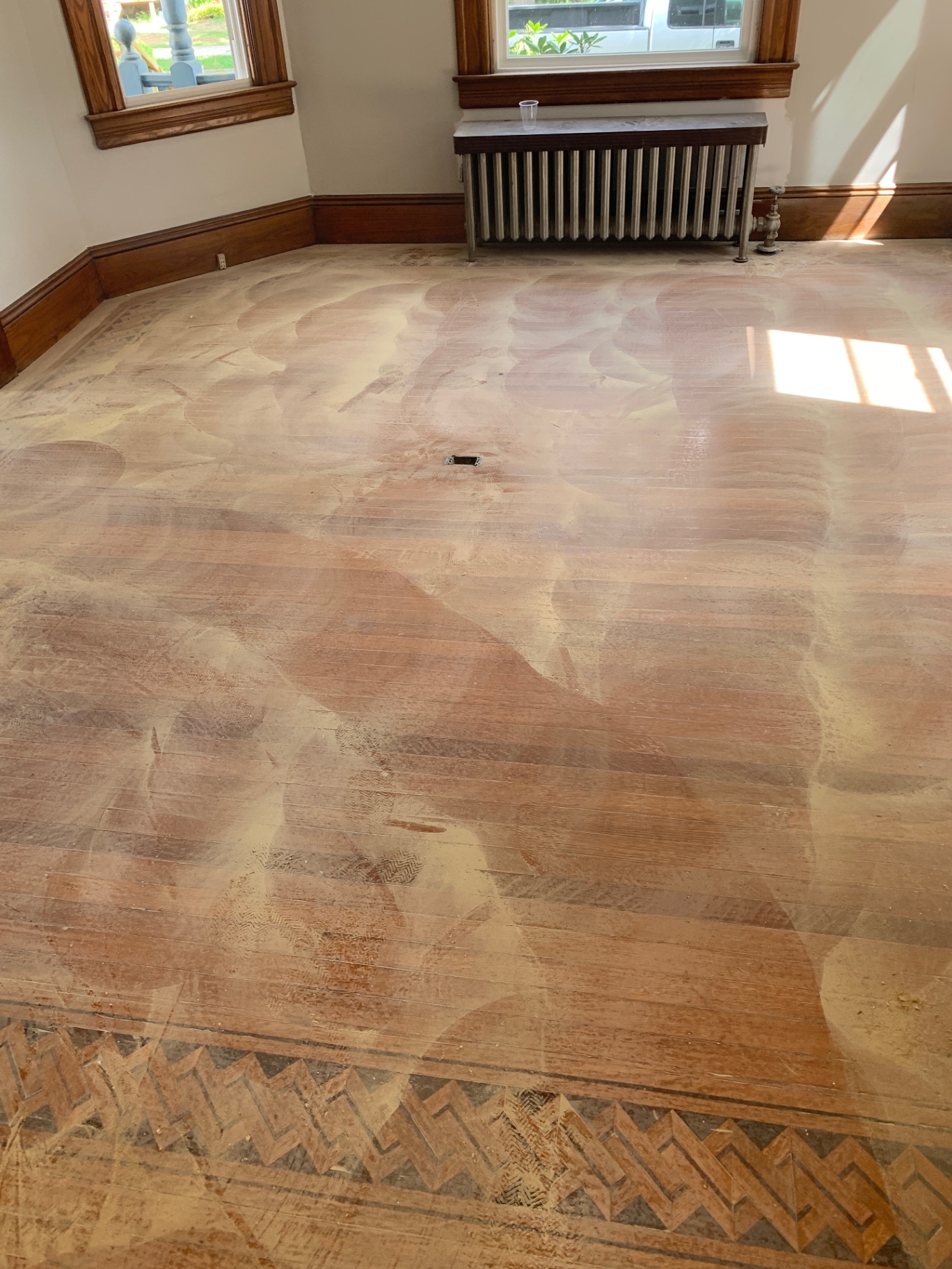Inlaid parlor floor — before maintenance buff and re-coat