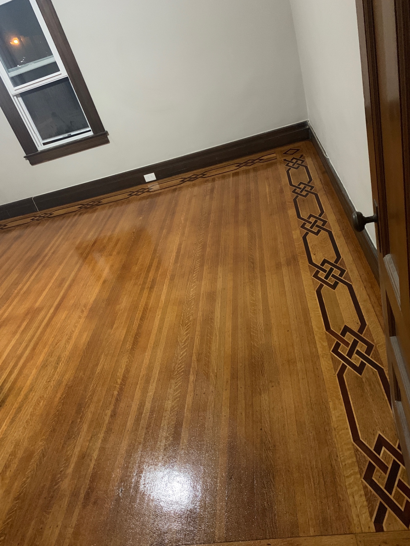 Inlaid parlor floor after a maintenance buff and re-coat